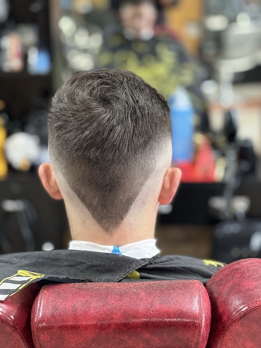 Hair design with a clean part